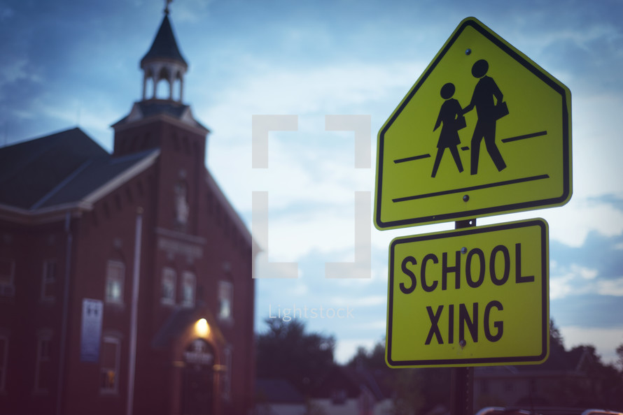 school crossing sign and a church 