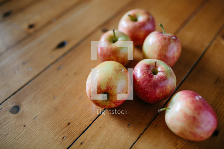 apples on a wood table  