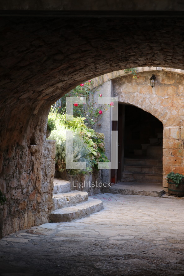 covered arched stone walkway 