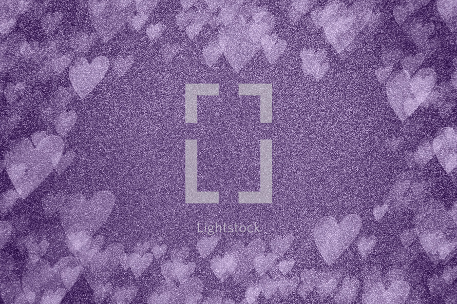 purple background with bokeh hearts 