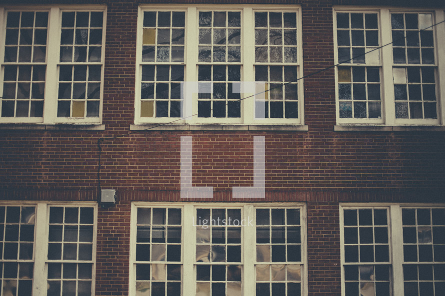 Many paned windows in a brick building.