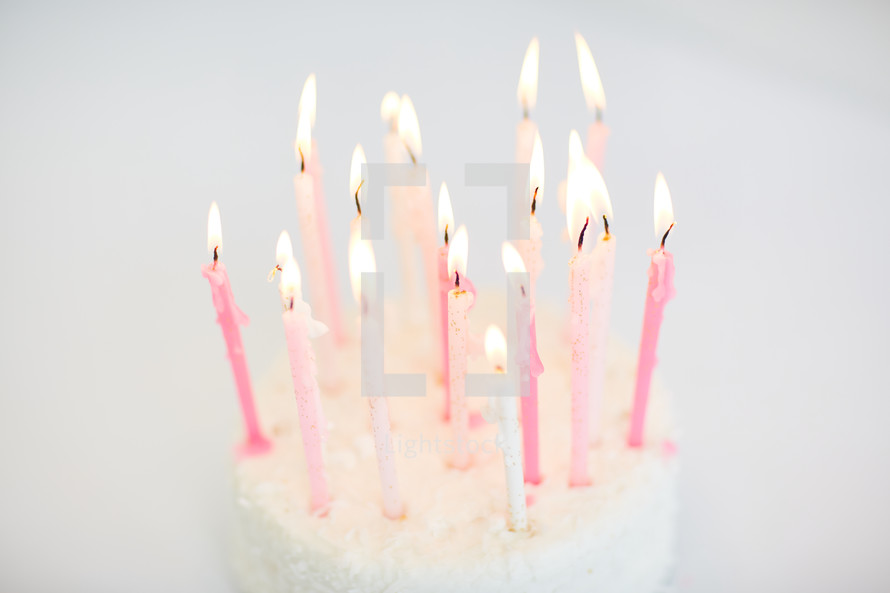 flames on birthday candles on a cake
