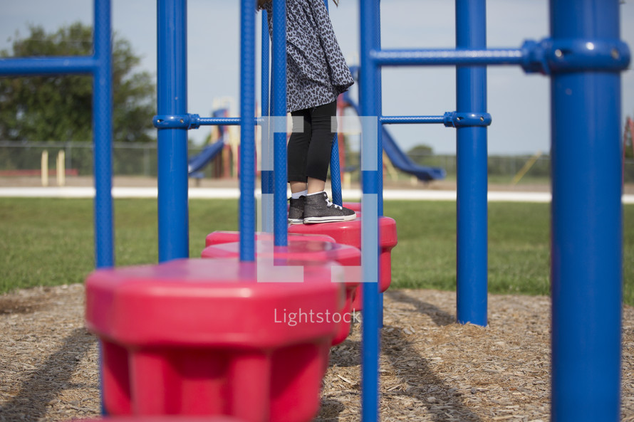 a little girl on a playground 