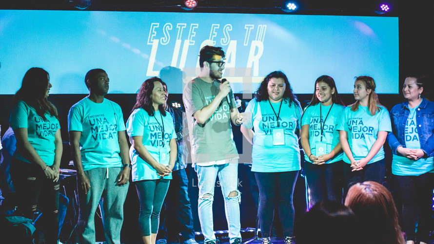 young people on stage during a worship service 