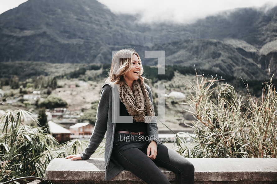 smiling woman in a scarf and sweater 