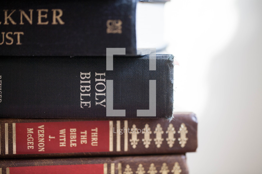 stack of books and Bible 