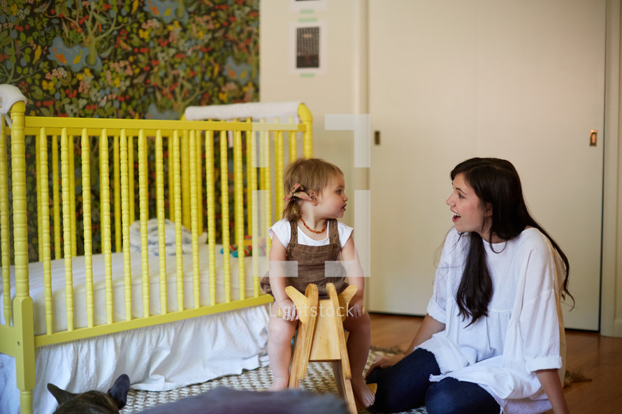 a mother and daughter in her nursery 