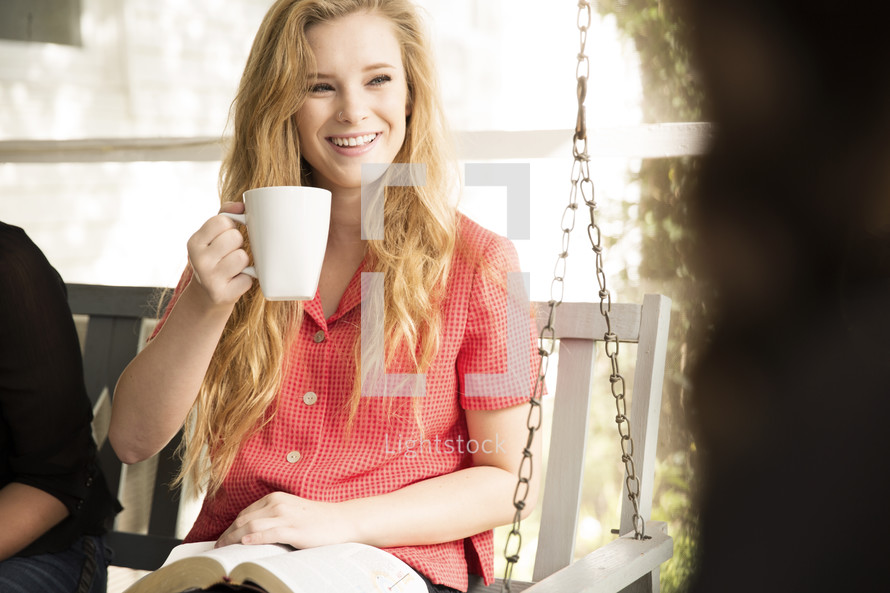 woman drinking coffee at a woman's Bible study 