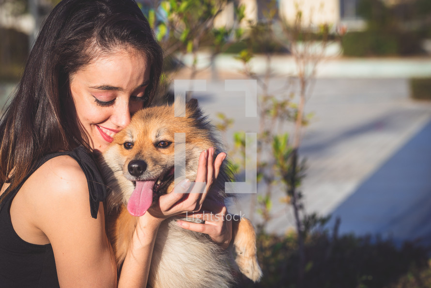 woman hugging dog with copy space for text