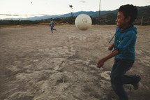 child playing soccer 