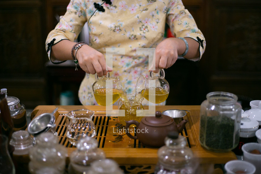 a woman pouring tea 
