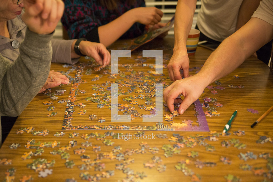 family working on a puzzle 