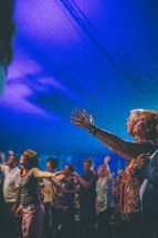 praising God at a contemporary worship service 