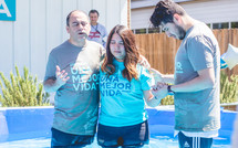 a young woman being baptized 