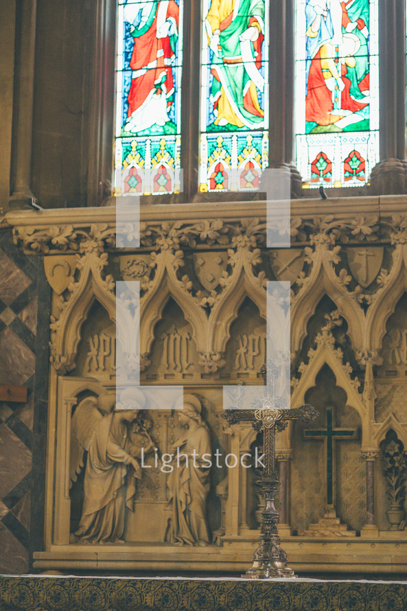 altar and stained glass windows cross old angels stone