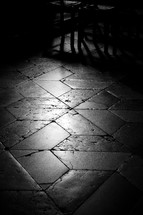 sunlight on a brick and tile floor in a cathedral 