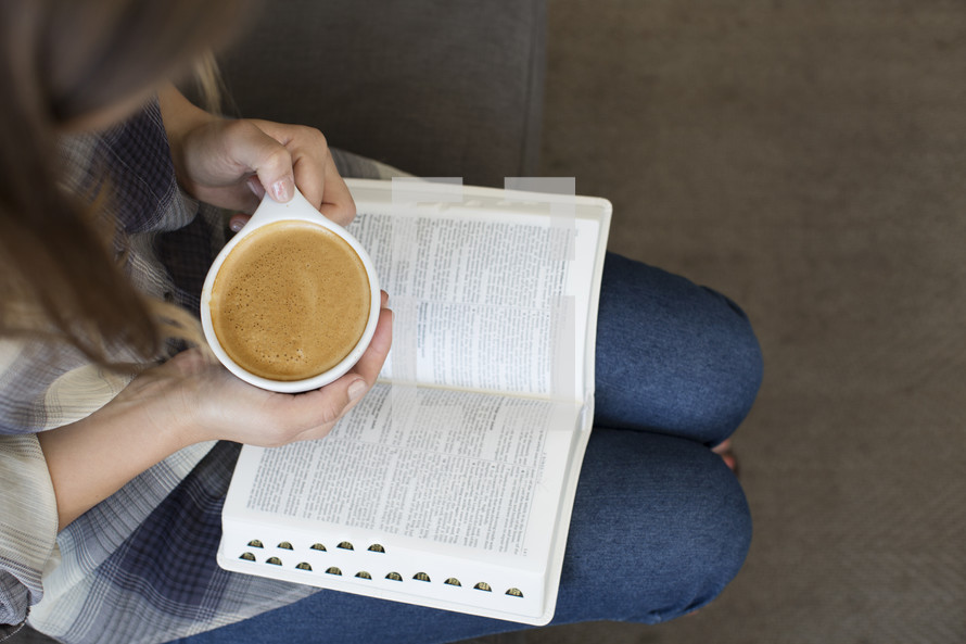 woman with a Bible in her lap and a cup of latte 