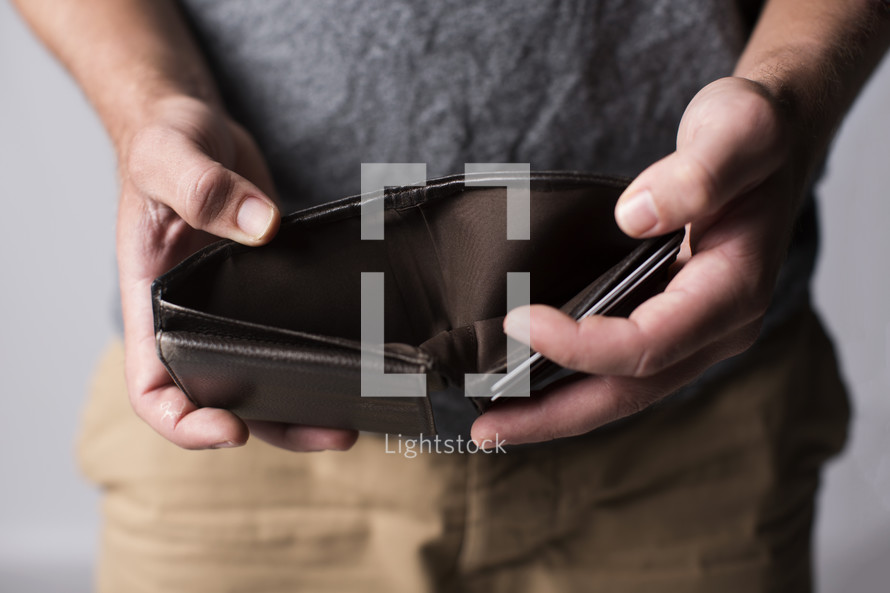 man holding an empty wallet 