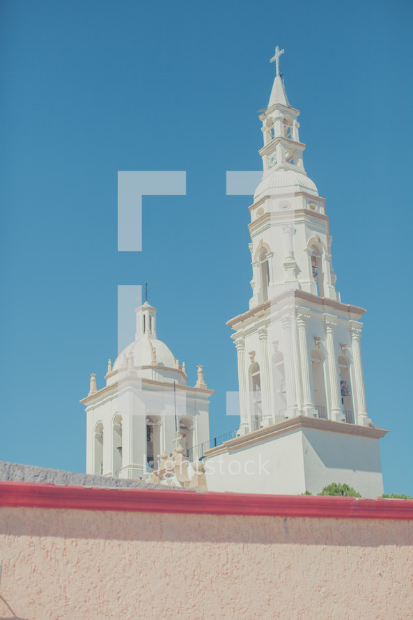 a church steeple in a blue sky 