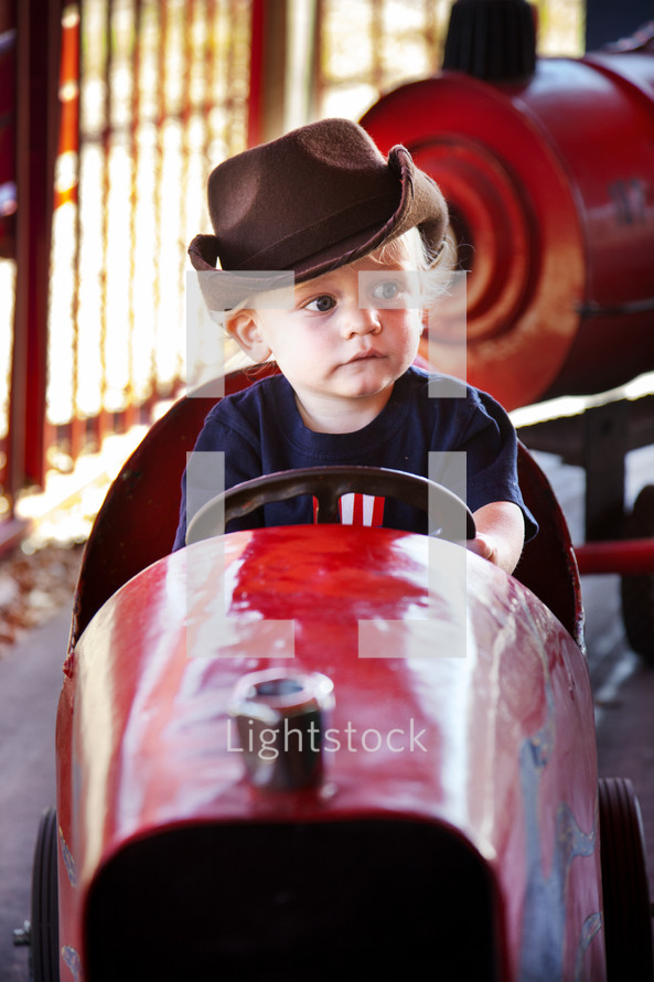 toddler boy on carnival ride 