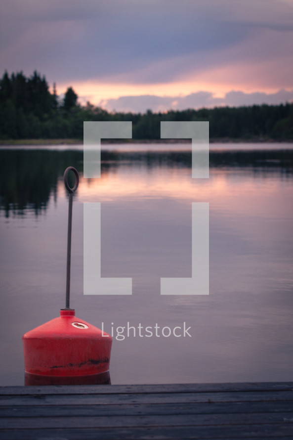 A buoy in front of a dramatic sky