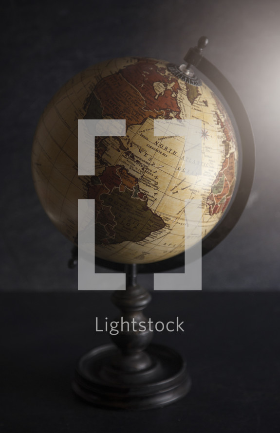 Globe on a Dark Background with Light Shining on It