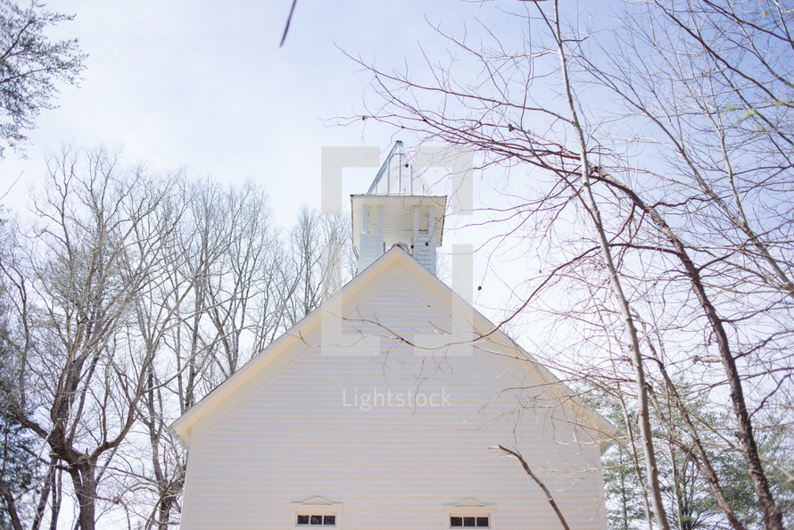 Steeple of a white church.