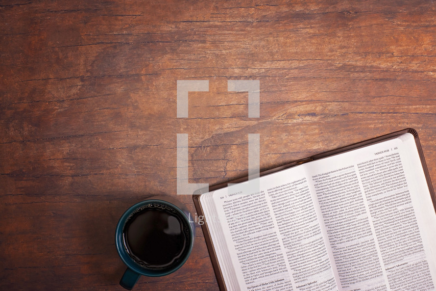 coffee cup with opened Bible 