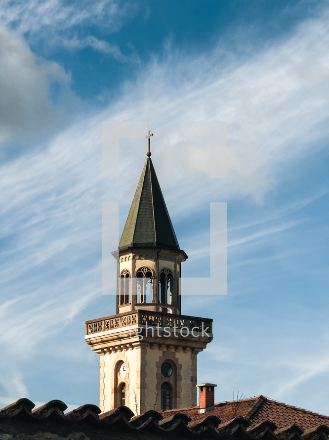 church bell tower on a light blue sky