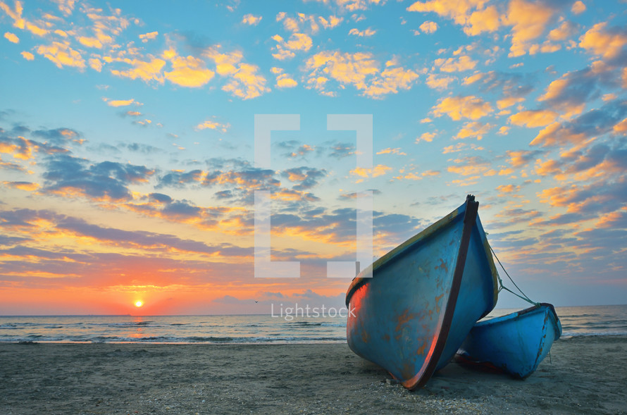 Sunrise at Black Sea over an old wooden fishing boats