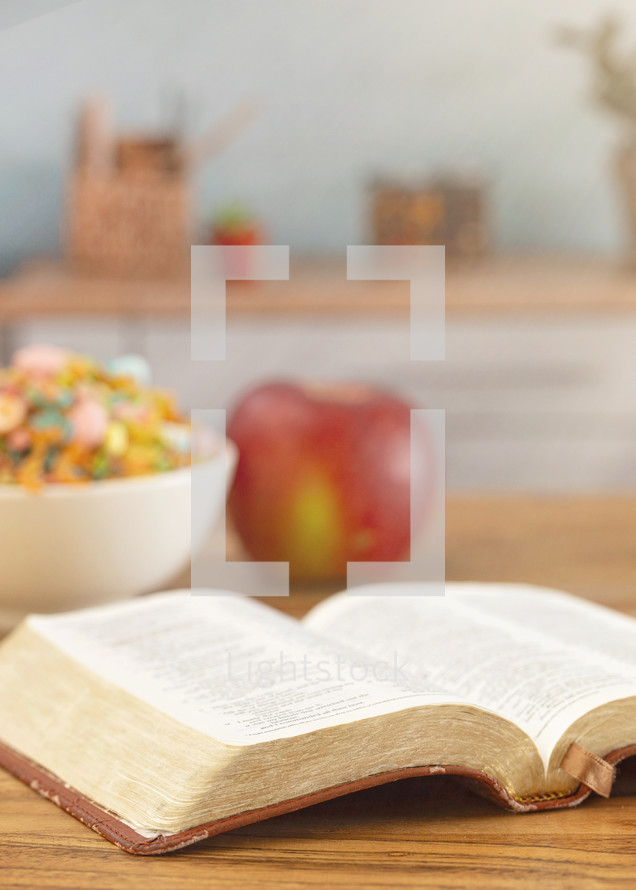 A Bible on a Wooden Table with Breakfast Set a Perfect Way to Start Your Day