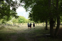 backpackers walking along a path 