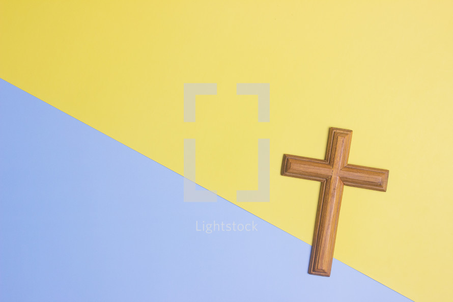 cross on a yellow and purple background 