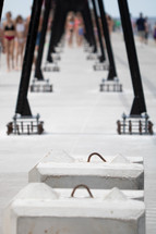 Abstract repetition shot of catwalk beams on the pier with people walking in background at Grand Haven State Park in Grand Haven, Michigan, western Michigan, Lake Michigan, Great Lakes