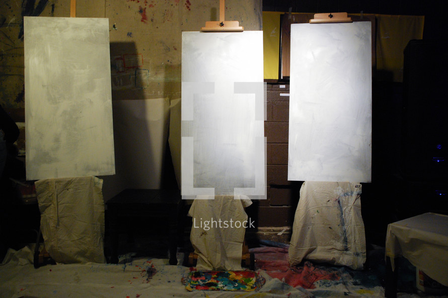 blank canvases on easels 