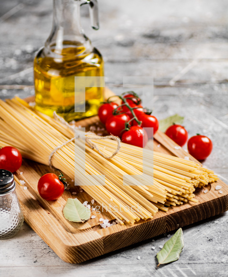 A pile of spaghetti dry on the table. Against a dark background. High quality photo