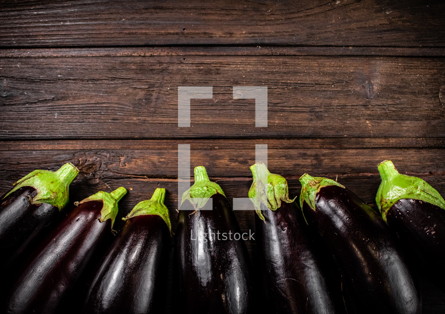 Fresh homemade eggplant on the table. On a wooden background. High quality photo