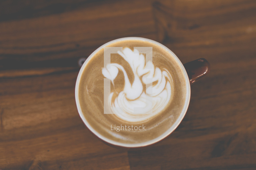 swan design in creamer in coffee 