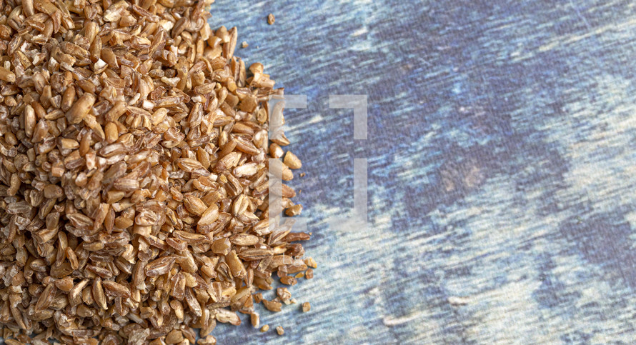 grains on blue wood background  