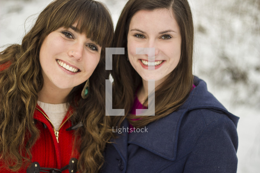 Two girls outdoors in the snow