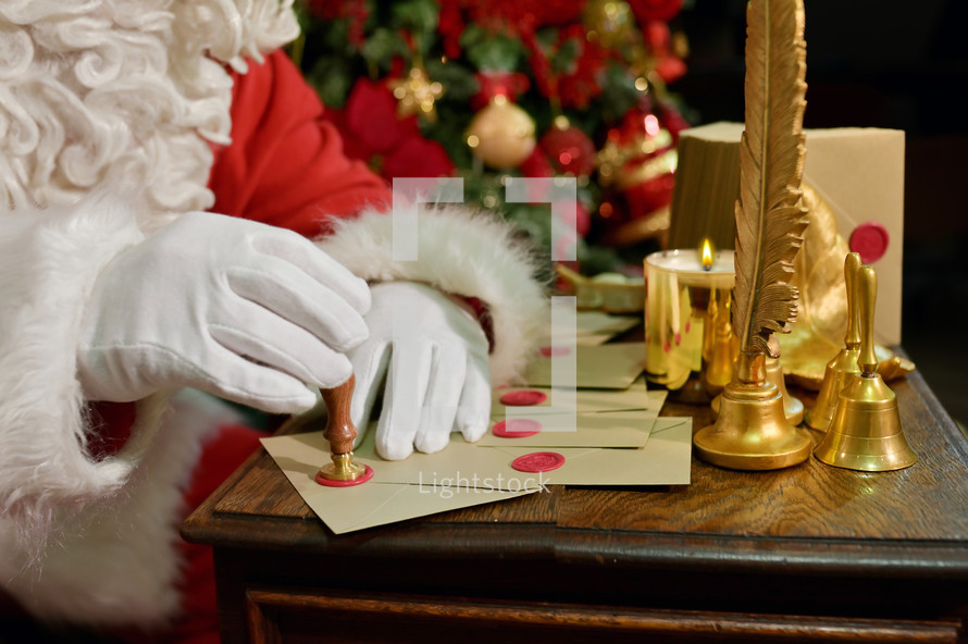 Santa Claus sealing letters 