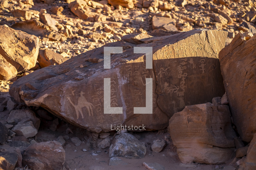 hieroglyphs on rocks in the desert 
