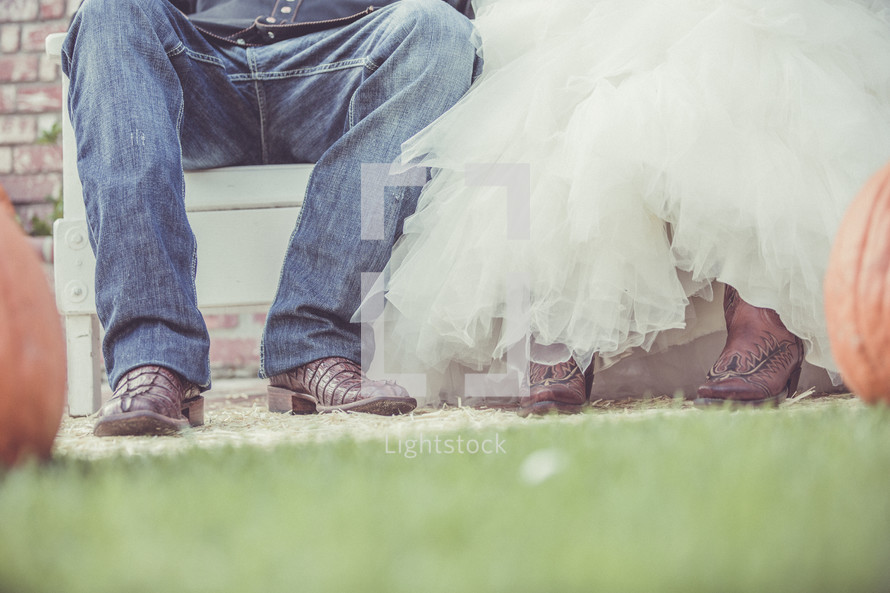 bride and groom in cowboy boots 