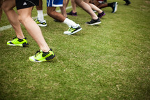 athletes in the runners stance at the starting line 