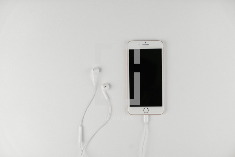 iPhone with earbuds 