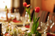 festive set table for the holiday with tulips flowers. High quality photo.