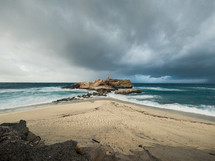 Beach with stormy sea in winter