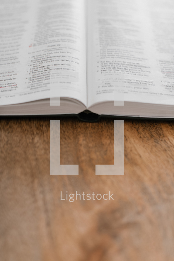open Bible on a wooden desk 