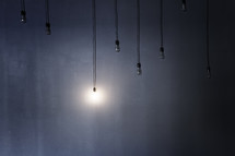 hanging lights, with one light turned on 