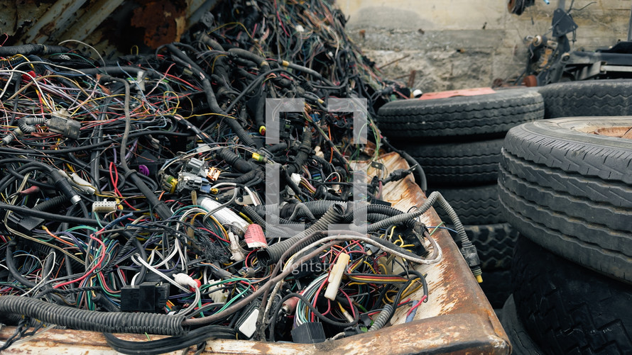 electrical cables to be recycled piled up in landfill 